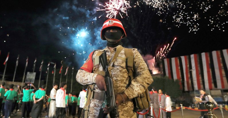 A security personnel stands guard during a ceremony organized by Houthi rebels to mark the 12th anniversary of takeover of Yemeni capital, in Sanaa, Yemen, Sept. 20, 2026. (AFP Photo)