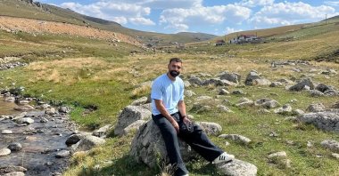 Trabzonspor's Mohamed Salah poses for a photo sitting on a stone in Kurtdere Highland in Maçka, Trabzon, Türkiye, Sept. 16, 2026. (Mohamed Salah on Instagram)