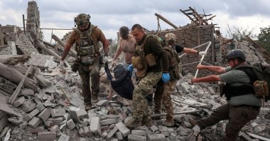 Combat medics evacuate a wounded person found under debris of a private house destroyed during a Russian airstrike in the frontline city of Kramatorsk, Ukraine, Sept. 22, 2026. (Reuters Photo)