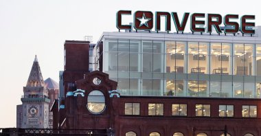 The Converse logo is displayed on the roof of the company's world headquarters, West End neighborhood, Boston, U.S., Dec. 28, 2016. (AP Photo)