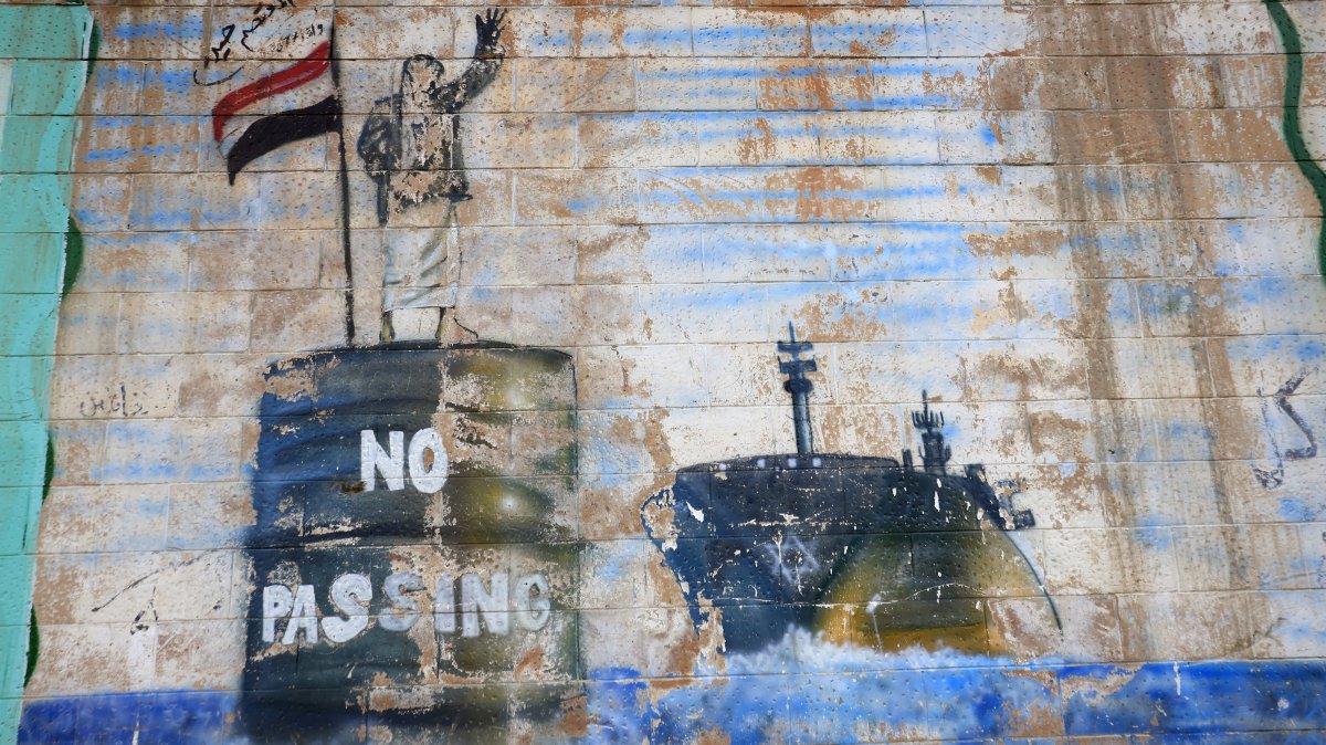 A graffiti sprayed on the wall of the shuttered Saudi Embassy depicts a Houthi fighter stopping a ship, Sanaa, Yemen, Sept. 11, 2026. (EPA Photo)