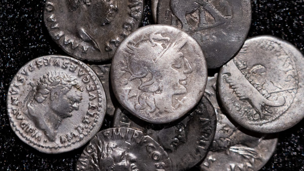 Roman coins, including the 1 coin (C) dating from 148 B.C., when Rome was still a republic without an emperor, are on display at the LVR State Museum, Bonn, Germany, Sept. 22, 2026. (AP Photo)