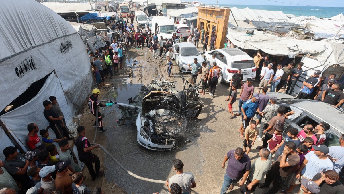 Palestinian firefighters extinguish a fire on a vehicle hit by an Israeli airstrike in Khan Younis, in the southern Gaza Strip, Sept. 23, 2026. (Reuters Photo)