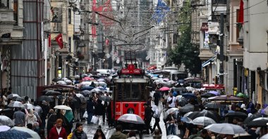 People walk with umbrellas amid heavy rain, Taksim, Istanbul, Türkiye, Sept. 16, 2026. (AA Photo)