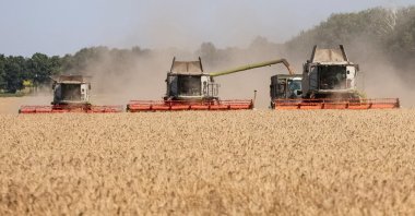 Combines harvest wheat in a field, Kharkiv region, Ukraine, Aug. 3, 2026. (Reuters Photo)