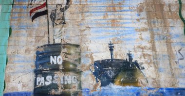 A graffiti sprayed on the wall of the shuttered Saudi Embassy depicts a Houthi fighter stopping a ship, Sanaa, Yemen, Sept. 11, 2026. (EPA Photo)