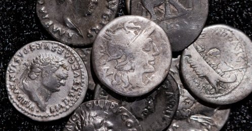 Roman coins, including the 1 coin (C) dating from 148 B.C., when Rome was still a republic without an emperor, are on display at the LVR State Museum, Bonn, Germany, Sept. 22, 2026. (AP Photo)