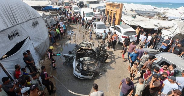 Palestinian firefighters extinguish a fire on a vehicle hit by an Israeli airstrike in Khan Younis, in the southern Gaza Strip, Sept. 23, 2026. (Reuters Photo)