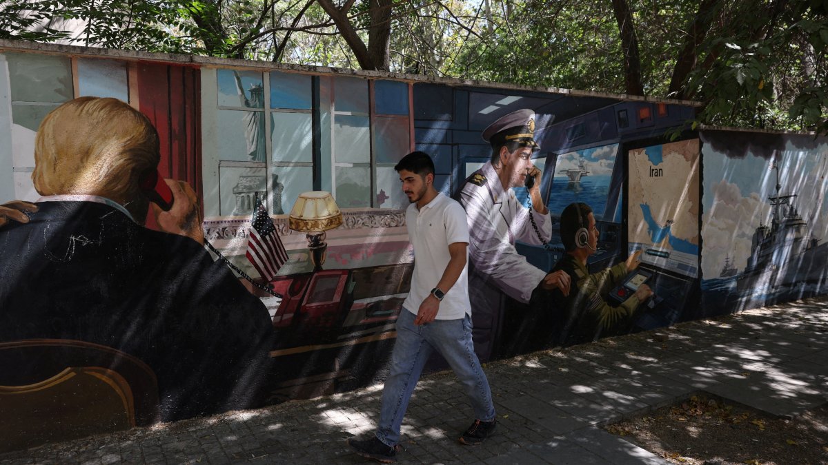 A man walks past an anti-U.S. mural in Tehran, Iran, Sept. 23, 2026. (Reuters Photo)