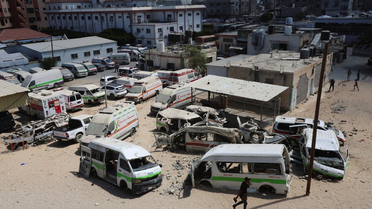 A Palestinian man walks near damaged ambulances and vehicles, amid shortages of fuel and oil needed to run the generators, at Nasser Hospital in Khan Younis, in the southern Gaza Strip, Sept., 2026. (Reuters File Photo)