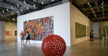 People seen walking in the exhibition room "Floating Island" ("Yüzen Adalar") in the new building of Istanbul Modern Museum at the Karakoy waterfront, Istanbul, Türkiye, June 20, 2023. (Getty Images Photo)