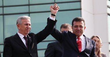 Former Istanbul Mayor Ekrem Imamoğlu (R) and Ankara Mayor Mansur Yavaş (L) greet supporters, Istanbul, Türkiye, Jan. 31, 2025. (Reuters Photo)