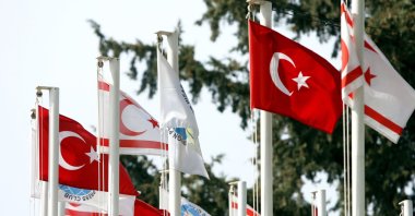 The flags of Türkiye and the TRNC fly close to the border with Greek Cyprus at the Ledra Palace checkpoint, Lefkoşa (Nicosia), TRNC, Feb. 23, 2008. (Getty Images Photo)