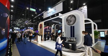 Visitors walk past the Thales Alenia Space exhibitor booth during the 75th International Astronautical Congress and exhibition show, IAC 2024, Milan, Italy, Oct. 16, 2024. (Shutterstock Photo)