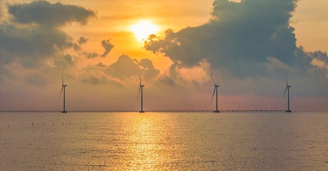 A windmill park on the sea is seen. (Shutterstock Photo)
