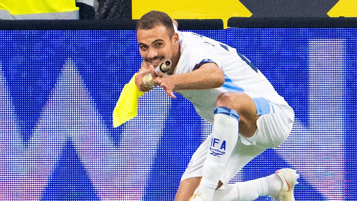 Israel's Saied Abu Farchi celebrates scoring his team's first goal while holding a pitch flag pole during the UEFA Nations League Group B3 match between Austria and Israel in Linz, Austria, Sept. 24, 2026. (AFP Photo)