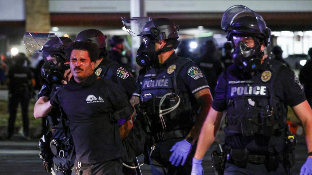 Police officers detain a man during a protest after a U.S. Immigration and Customs Enforcement (ICE) agent shot and wounded a man, city officials said, Austin, U.S., Sept. 20, 2026. (Reuters Photo)