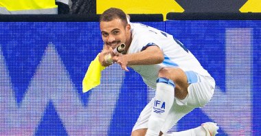 Israel's Saied Abu Farchi celebrates scoring his team's first goal while holding a pitch flag pole during the UEFA Nations League Group B3 match between Austria and Israel in Linz, Austria, Sept. 24, 2026. (AFP Photo)