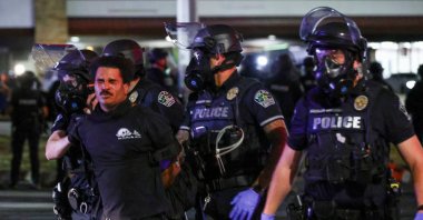 Police officers detain a man during a protest after a U.S. Immigration and Customs Enforcement (ICE) agent shot and wounded a man, city officials said, Austin, U.S., Sept. 20, 2026. (Reuters Photo)