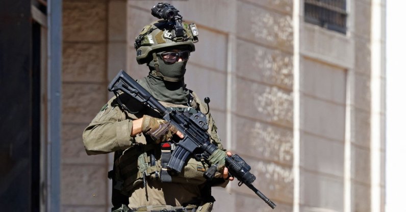 An Israeli soldier conducts a raid in the Palestinian town of Beddu, northwest of Jerusalem, Sept. 21, 2026. (AFP Photo)