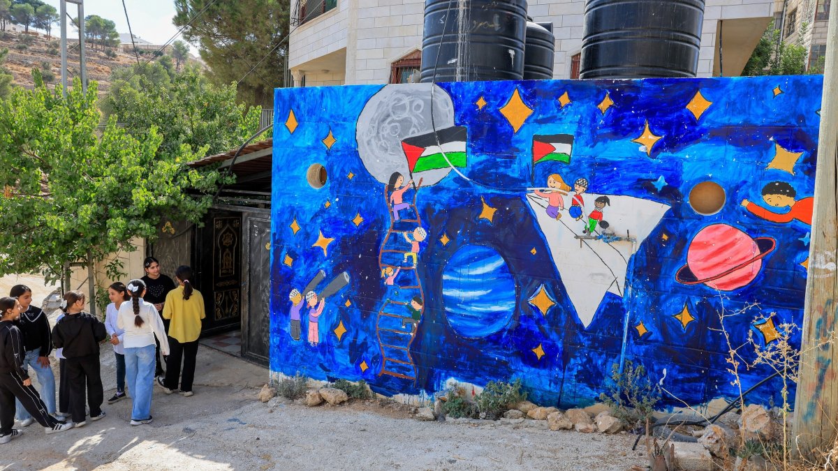 Palestinian children stand outside Rommana studio in Hebron, the Israeli-occupied West Bank, Palestine, Sept. 22, 2026. (Reuters Photo)