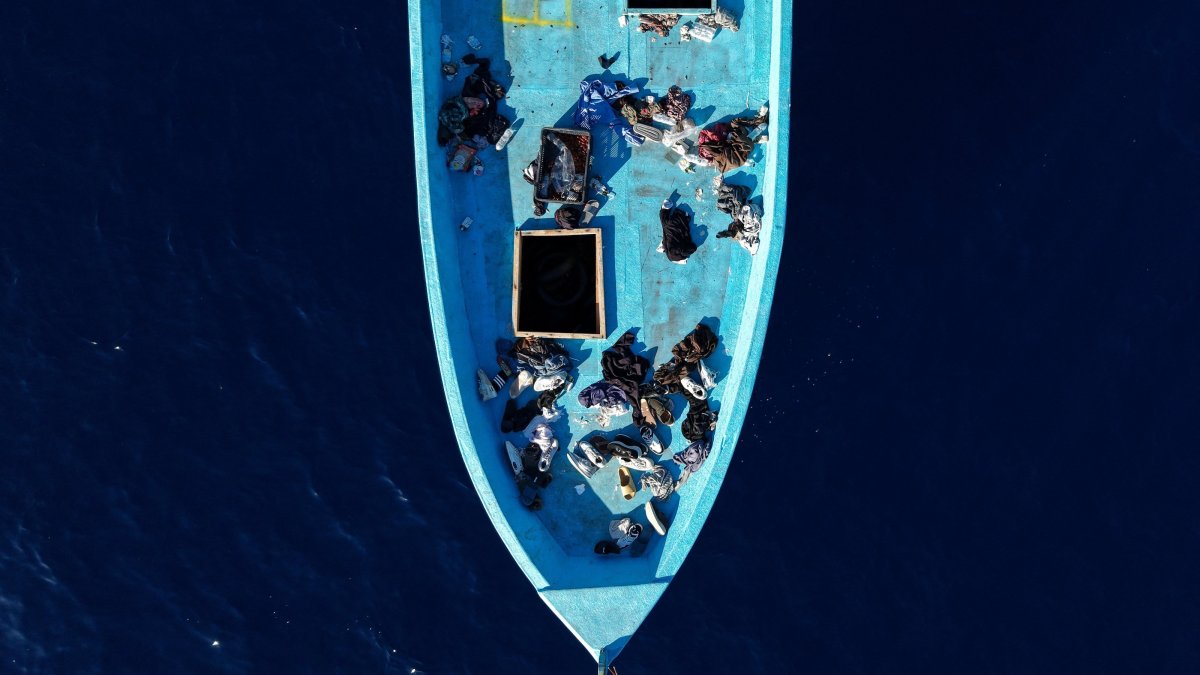 A drone view shows clothes and personal belongings left aboard an empty migrant boat after its occupants were rescued by Italy's Guardia di Finanza between Sicily and Malta in the central Mediterranean, Sept. 16, 2026. (Reuters Photo)