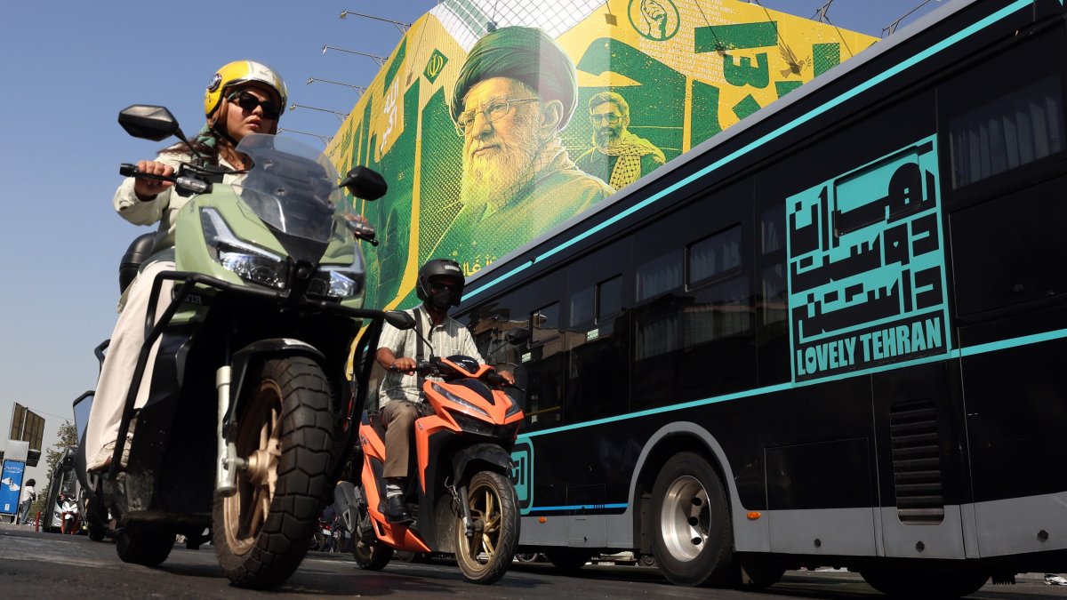 People drive past a billboard depicting former Iranian Supreme Leader Ali Khamenei, in Tehran, Iran, Sept. 27, 2026. (EPA Photo)