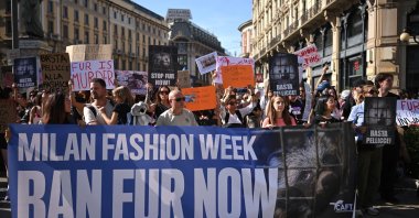 Activists take part in a protest against the use of animal fur in fashion, on the sidelines of Milan's fashion week, Milan, Italy, Sept. 26, 2026. (AFP Photo)