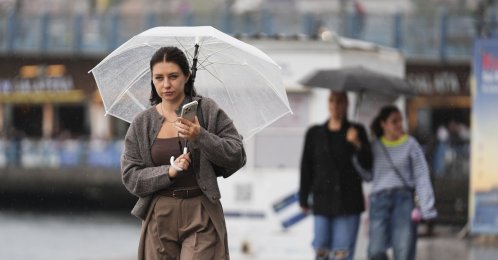 A woman walks along the sidewalk in rain, Istanbul, Türkiye, Sept. 16, 2026. (AA Photo)
