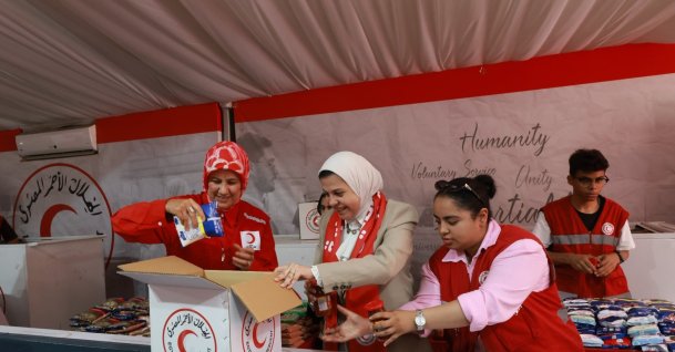 Turkish Red Crescent President Fatma Meriç Yılmaz and a delegation pack aid supplies for Gaza, Rafah, Egypt, Aug. 25, 2026. (AA Photo)