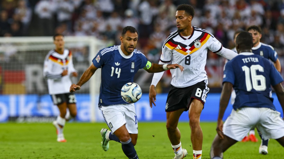 Greece's Vangelis Pavlidis (L) and Felix Nmecha of Germany in action during the UEFA Nations League match in Augsburg, Germany, Sept. 27, 2026. (EPA Photo)