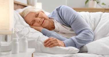 An elderly woman sleeping in her bedroom. (Shutterstock Photo)