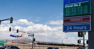 A Terrible's gas station on Sunset Road displays its gas prices as a Southwest Airlines plane prepares to land at Harry Reid International Airport in Las Vegas, U.S., Sept. 18, 2026. (AP Photo)