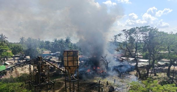 In this photo provided by Wai Hun Aung, smoke rises from a market after the area was allegedly hit by the military's airstrike in Kyauktaw township in Rakhine state, Myanmar, Monday, Sept. 28, 2026. (Wai Hun Aung via AP)