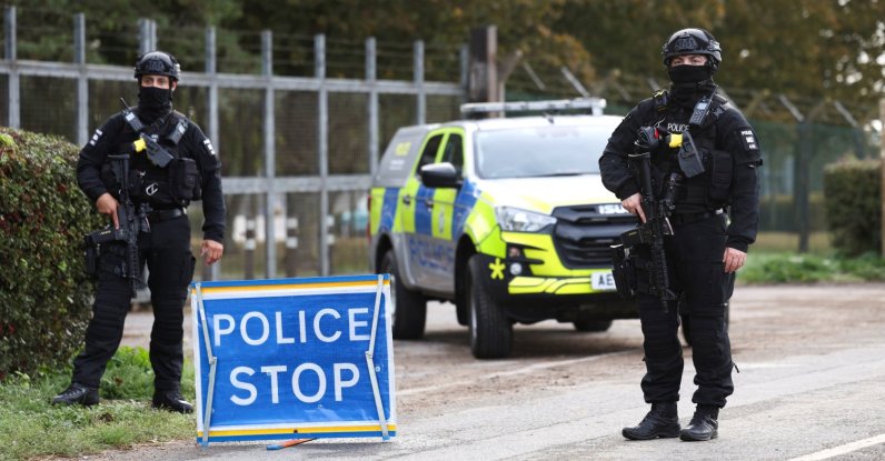 Armed police officers stand guard on a road outside the perimeter of the RAF Fairford airbase, in Fairford, Gloucestershire, U.K., Sept. 28, 2026. (Reuters Photo)