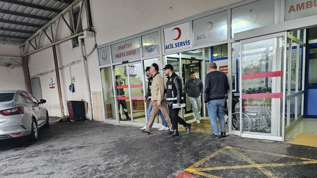 Turkish Football Federation (TFF) Central Referee Board (MHK) Chairman Ferhat Gündoğdu is escorted by police officers for a health check at a hospital's emergency department, Istanbul, Türkiye, Sept. 29, 2026. (IHA Photo)