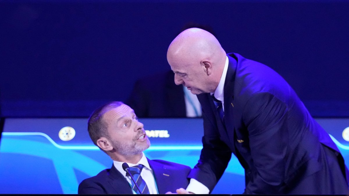 FIFA President Gianni Infantino (R) talks to UEFA President Aleksander Ceferin during the FIFA 75th Congress at the Conmebol Convention Center, Luque, Paraguay, May 15, 2025. (AP Photo)
