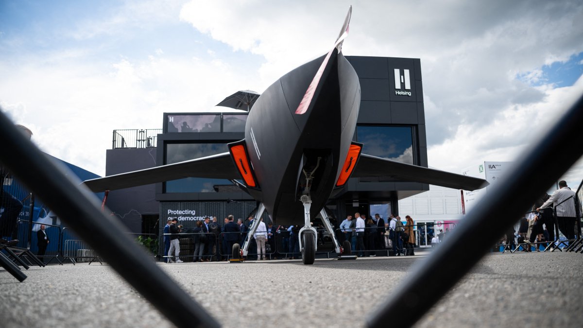 A model of the CA-1 Europa drone, manufactured by the defense contractor Helsing, is on display in front of the company’s booth at the International Aerospace Exhibition (ILA) at the Berlin ExpoCenter Airport, June 11, 2026. (AFP File Photo)