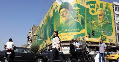 Iranians walk past a billboard depicting former Iranian Supreme Leader Ali Khamenei and former Iranian Quds Force commander Qasem Soleimani, in Tehran, Iran, Sept. 27, 2026. (EPA Photo)