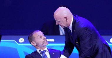 FIFA President Gianni Infantino (R) talks to UEFA President Aleksander Ceferin during the FIFA 75th Congress at the Conmebol Convention Center, Luque, Paraguay, May 15, 2025. (AP Photo)