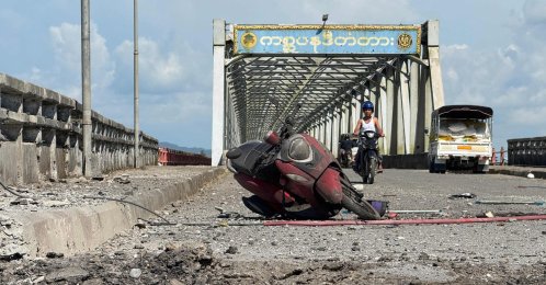 A damaged motorcycle sits on the Kisapanadi Bridge following a military airstrike on a market and the bridge in Kyauktaw, Western Rakhine state, Myanmar, Sept. 28, 2026. (AFP Photo)