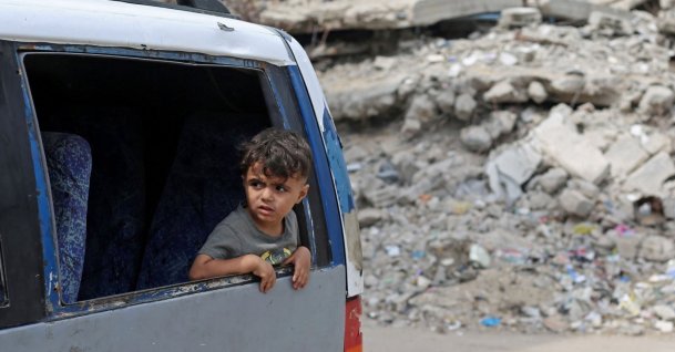 A boy looks out of a vehicle window during a mass funeral at the Nuseirat refugee camp, central Gaza Strip, Palestine, Sept. 29, 2026. (AFP Photo)