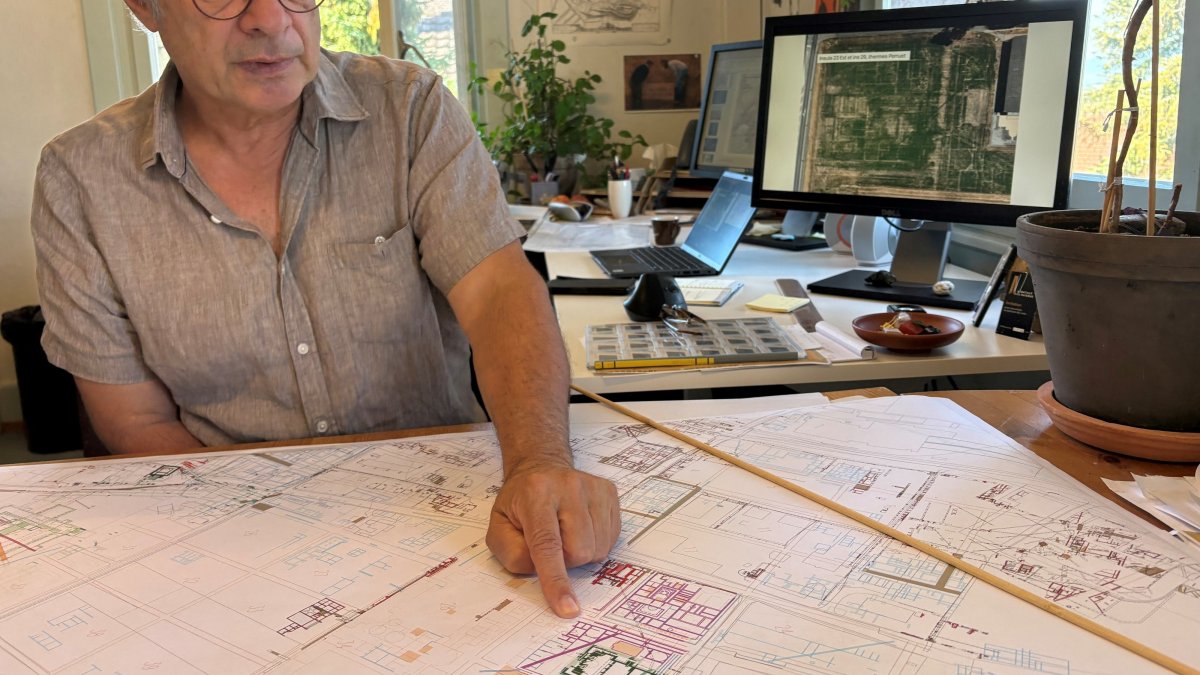 Archaeologist Pierre Blanc, head of excavations for the Roman site and museum of Avenches, points to new Roman buildings added to the map, Vaud, Switzerland, Sept. 28, 2026. (Reuters Photo)