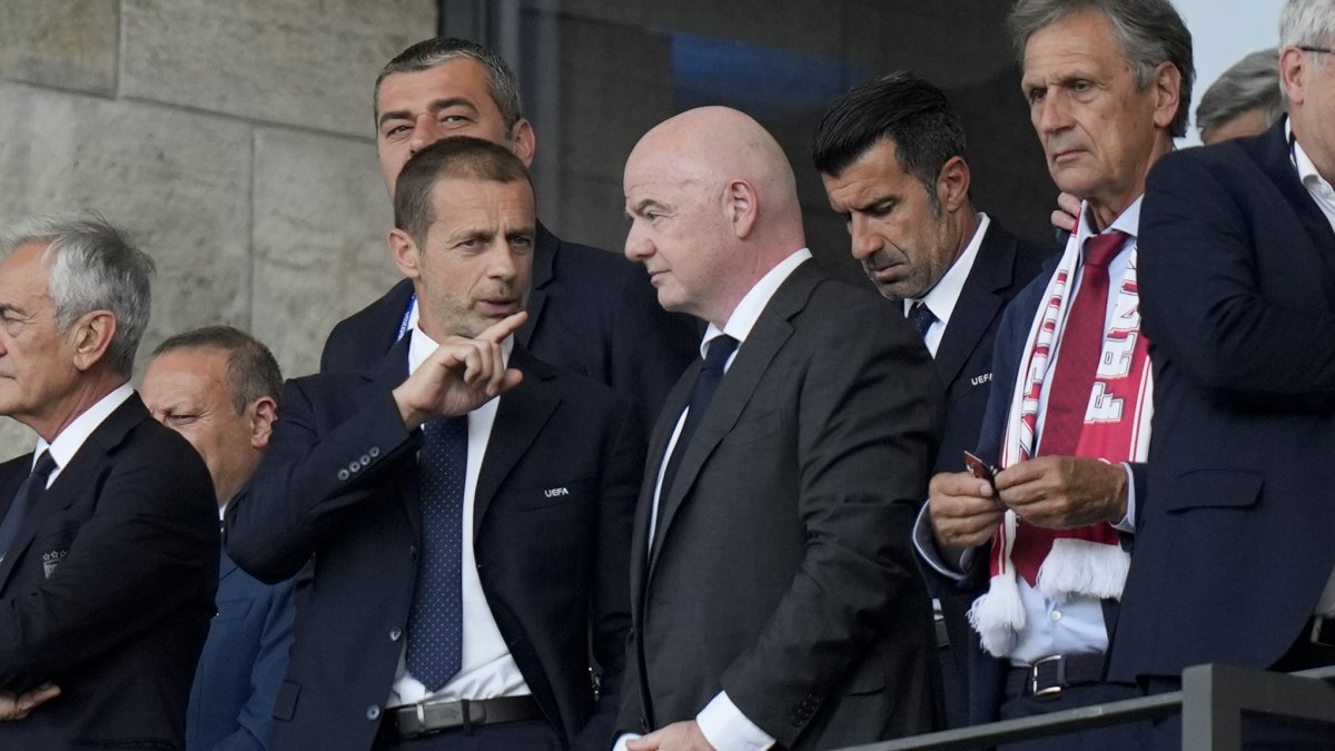UEFA President Aleksander Ceferin (L) talks to FIFA President Gianni Infantino before a round-of-sixteen match between Switzerland and Italy at the Euro 2024 tournament, Berlin, Germany, June 29, 2024. (AP Photo)