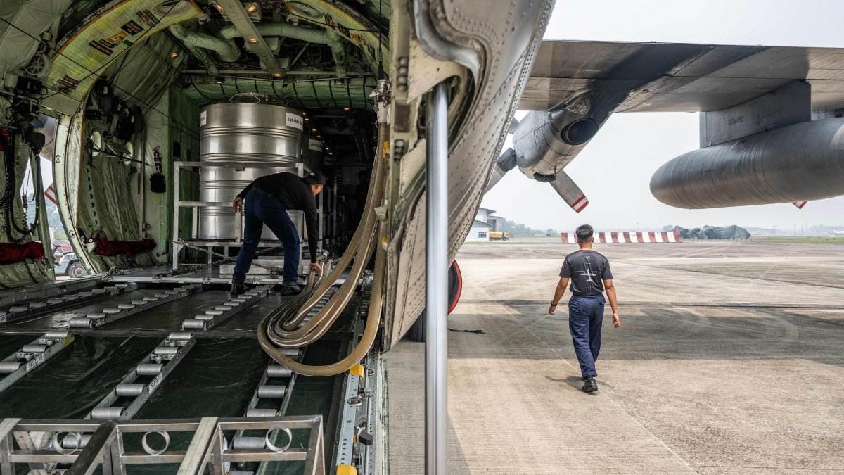 Members of the Royal Malaysian Air Force prepare a C-130 aircraft for a cloud-seeding operations at the air force base, Kuching, Sarawak, Malaysia, Sept. 6, 2026. (AFP Photo)
