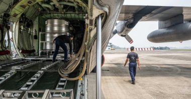 Members of the Royal Malaysian Air Force prepare a C-130 aircraft for a cloud-seeding operations at the air force base, Kuching, Sarawak, Malaysia, Sept. 6, 2026. (AFP Photo)