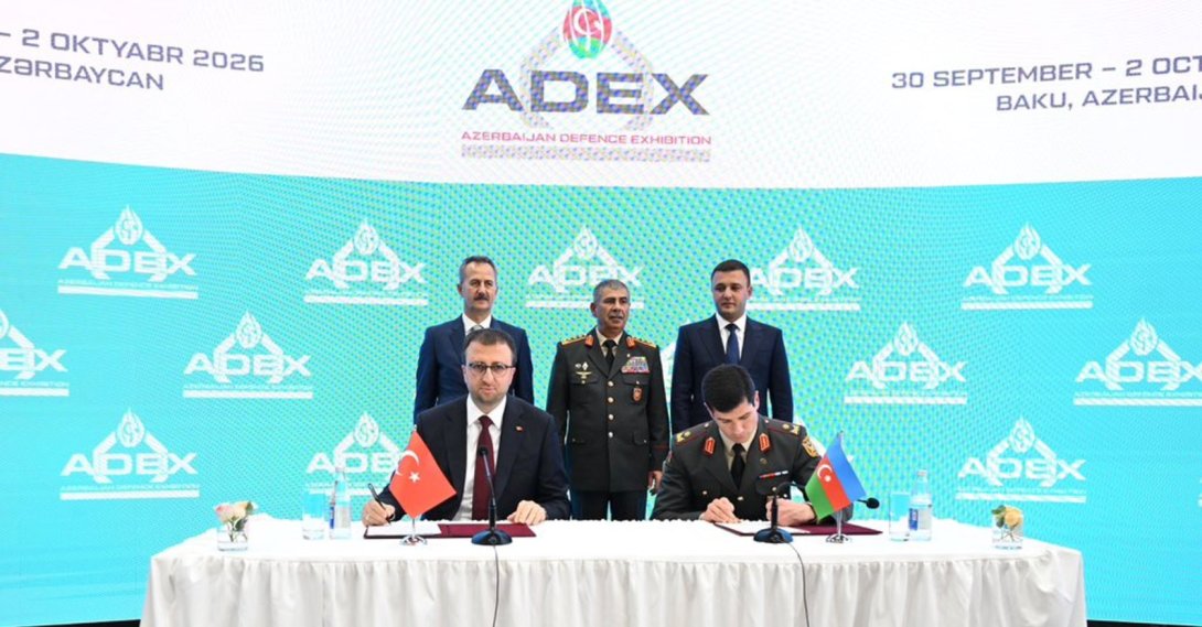 The head of SSB Haluk Görgün (L) and Azerbaijan's Defense Minister Zakir Hasanov (C) oversee the signing of agreements during ADEX 2026, Baku, Azerbaijan, Sept. 30, 2026. (AA Photo)