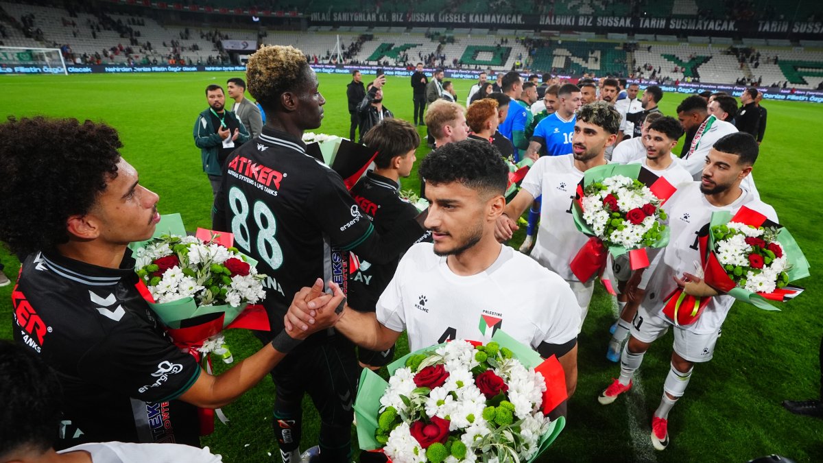 Konyaspor and Palestine national team players exchange flowers after the friendly match at Konya Büyükşehir Stadium, Konya, Türkiye, Sept. 30, 2026. (AA Photo)