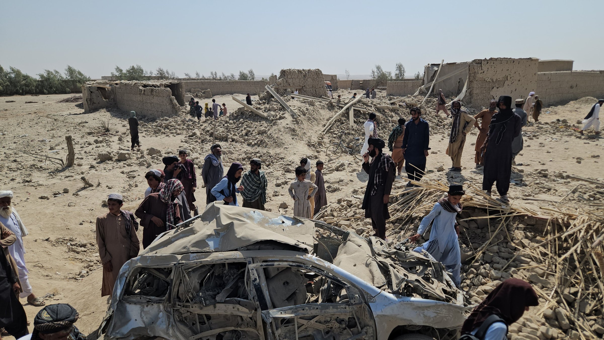 Locals survey the scene of Pakistani airstrikes in Helmand, Afghanistan, Oct. 1, 2026. (EPA Phto)