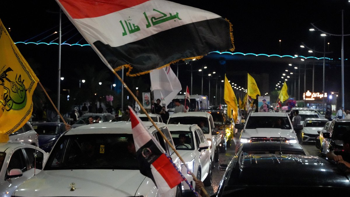 Supporters of a Shiite armed group celebrate the withdrawal of U.S.-led coalition forces, in Basra, Iraq, Sept. 30, 2026. (Reuters Photo)